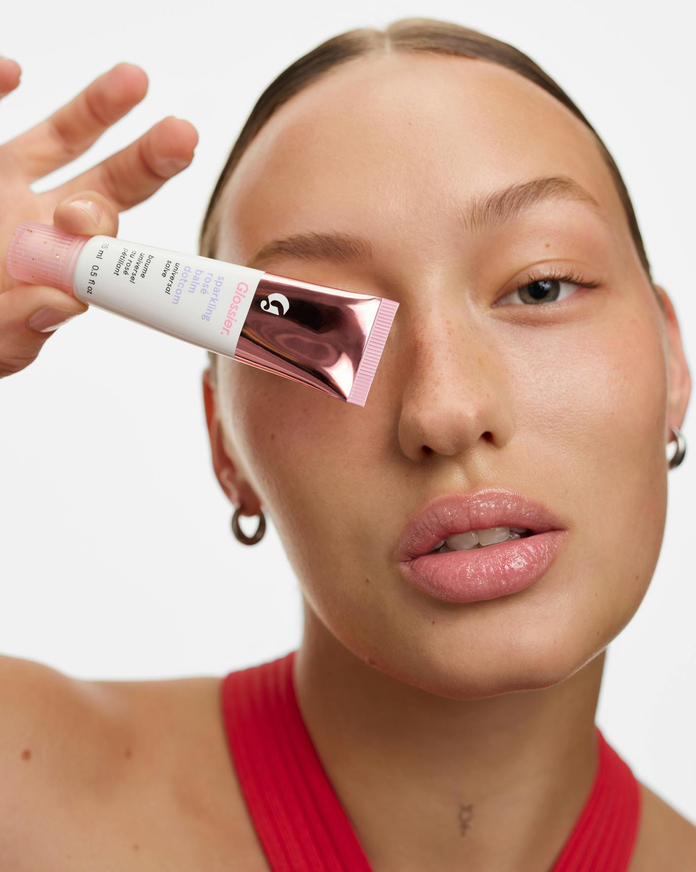 Sasha wears Sparkling Rosé Balm Dotcom.